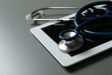 Stethoscope and tablet on table, closeup. medical students stuffの写真素材