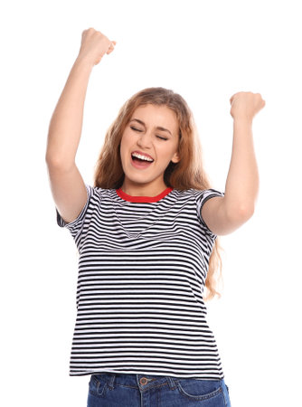 Happy young woman celebrating victory on white backgroundの写真素材