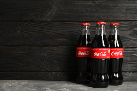 MYKOLAIV, UKRAINE - NOVEMBER 15, 2018: Bottles of Coca Cola on table. Space for textのeditorial素材