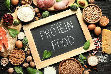 Chalkboard with written text Protein Food among natural products, top viewの写真素材