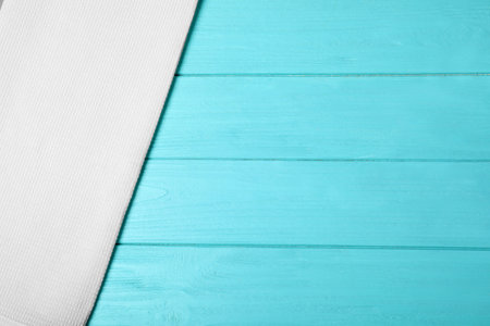 Fabric napkin and space for text on wooden background, top viewの写真素材