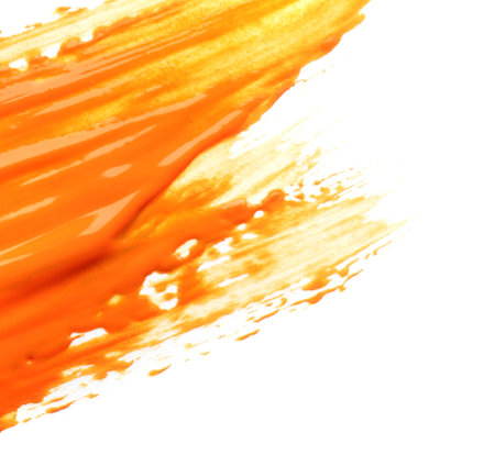 Abstract brushstroke of orange paint isolated on whiteの写真素材
