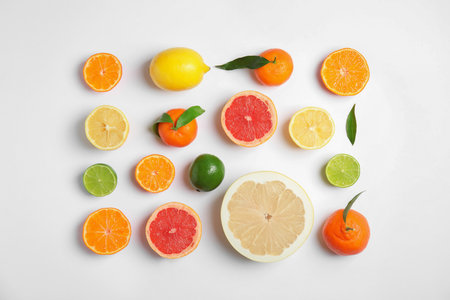 Different citrus fruits on white background, flat layの写真素材