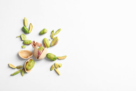 Composition with organic pistachio nuts on white background. Space for textの写真素材