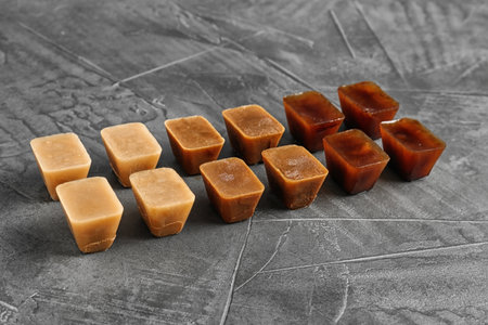 Composition with coffee ice cubes on gray table