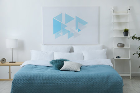 Light modern room interior with comfortable bedの写真素材