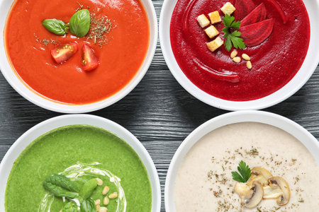 Various soups in bowls on wooden background, top view. healthy foodの写真素材