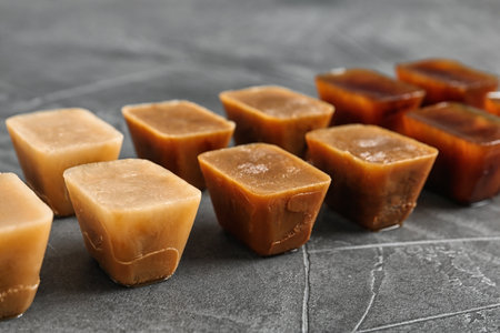 Composition with coffee ice cubes on gray table