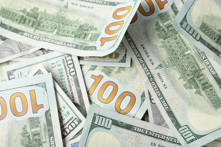 Many dollar banknotes as background. National american currency