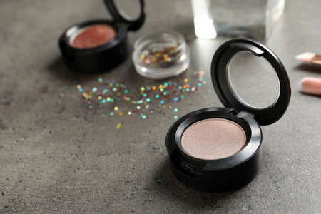 Eye shadow on gray table. Space for textの写真素材