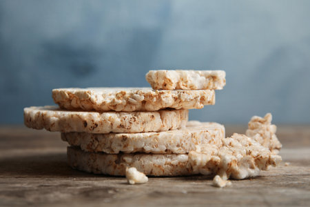 Stack of crunchy rice cakes on wooden table