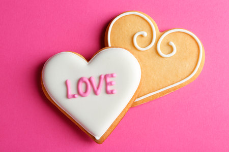 Decorated heart shaped cookies on color background, top view. Valentine's day treatの写真素材