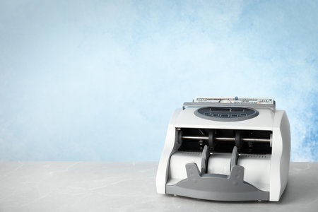 Modern bill counter with money on table. Space for textの写真素材