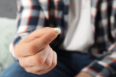 Man holding pill in hand, closeup view. health careの写真素材