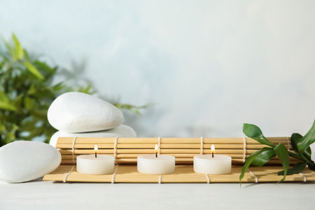Spa composition with burning candles on tableの写真素材