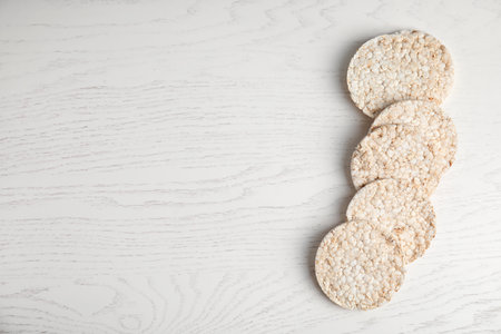 Crunchy rice cakes on white wooden background, top view. Space for textの写真素材