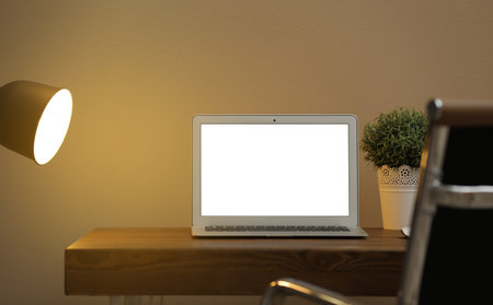 Laptop with blank screen on table indoors. Space for textの写真素材