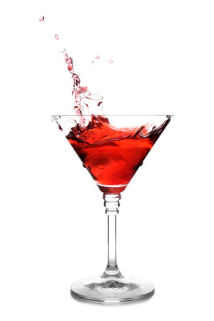 Glass of martini cocktail with splash on white backgroundの写真素材