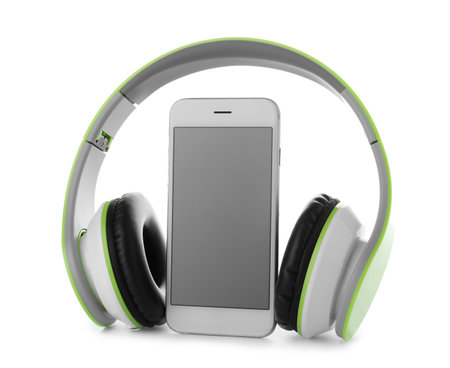 Smartphone with blank screen and headphones on white backgroundの写真素材