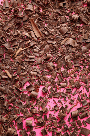 Chocolate curls on color background, top viewの写真素材