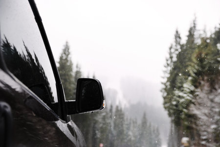 Car parked outdoors on snowy winter dayの写真素材