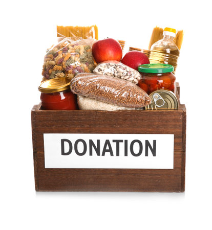 Donation box full of different products on white backgroundの写真素材