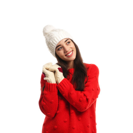 Young woman wearing warm clothes on white background. winter seasonの写真素材