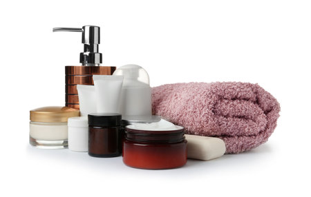 Various body care products and towels on white backgroundの写真素材
