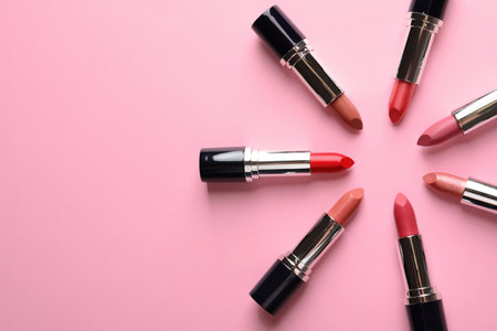 Flat lay composition with lipsticks and space for text on color backgroundの写真素材