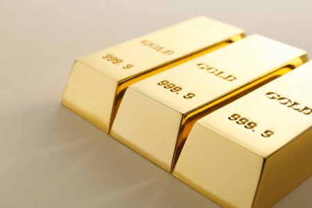 Precious shiny gold bars on light backgroundの写真素材