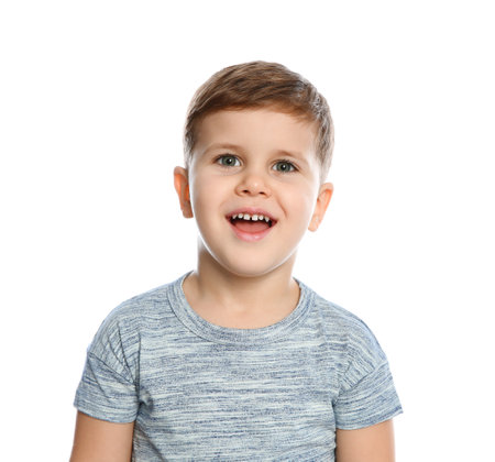 portrait of little boy laughing on white backgroundの写真素材