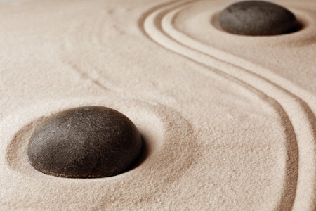 Zen garden stones on sand with pattern. meditation and harmonyの写真素材