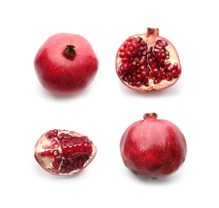 Ripe pomegranates on white background, flat lay. Delicious fruitの写真素材