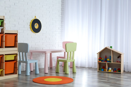 Modern child room interior with table and chairsの写真素材