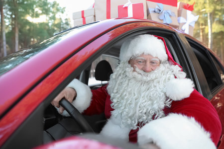Authentic Santa Claus in red car, view from outsideの写真素材