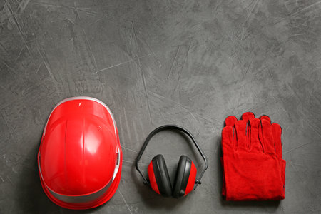 Flat lay composition with safety equipment and space for text on gray backgroundの写真素材