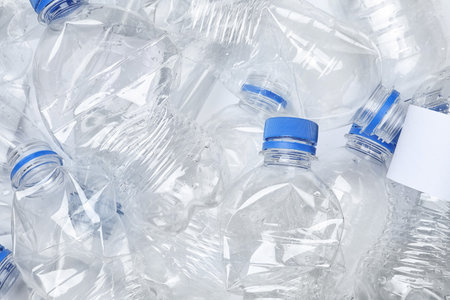 Pile of crumpled plastic bottles as background, closeup. recycling problemの写真素材
