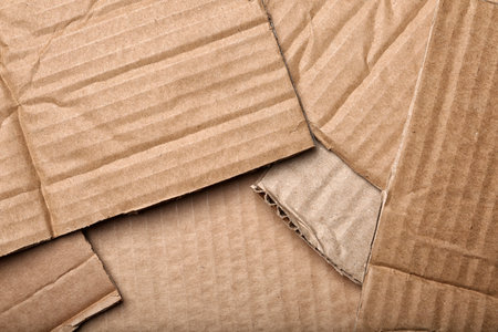 Pieces of cardboard as background, top view. recycling problemの写真素材
