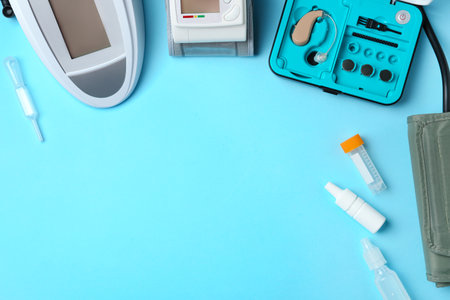 Flat lay composition with different medical objects and space for text on color background