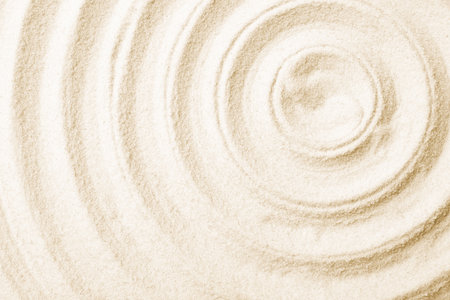 Zen garden pattern on sand as background, top view. meditation and harmonyの写真素材