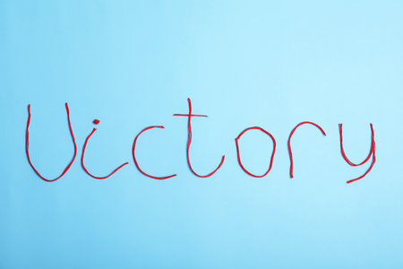Word Victory made of threads on color background, top viewの写真素材