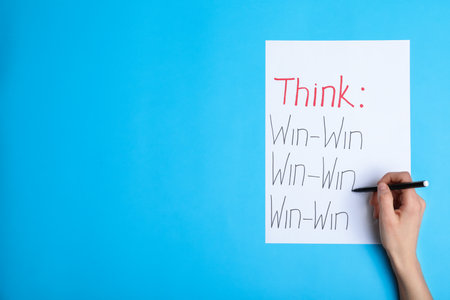 Woman writing motivational inscriptions, top view with space for text. Victory conceptの写真素材