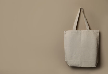 Eco tote bag hanging on color wall. space for designの写真素材