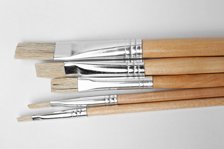 Different paint brushes on white background, top viewの写真素材