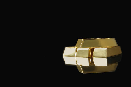 Shiny gold bars on black background. Space for textの写真素材