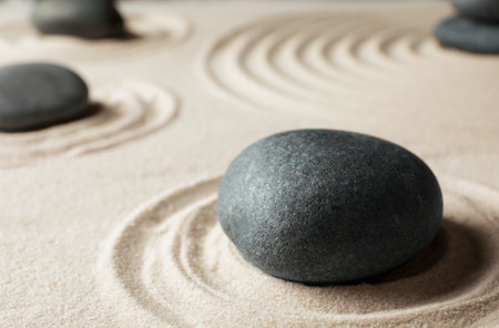 Zen garden stones on sand with pattern. meditation and harmonyの写真素材