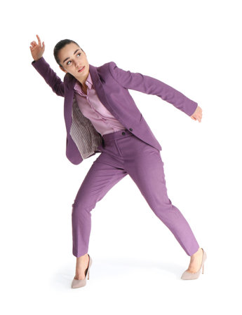 Businesswoman attracted to magnet on white backgroundの写真素材