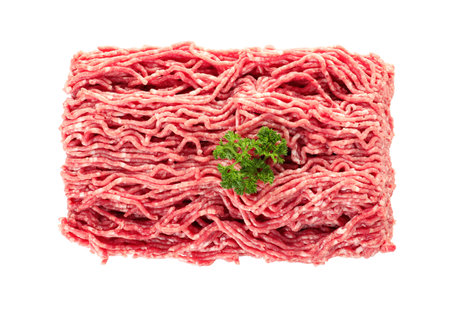 Minced meat with parsley on white background, top view