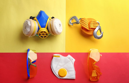 Flat lay composition with safety equipment on color backgroundの写真素材