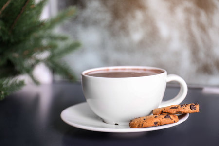Cup of aromatic cacao with cookies on table, closeup. Space for textの写真素材